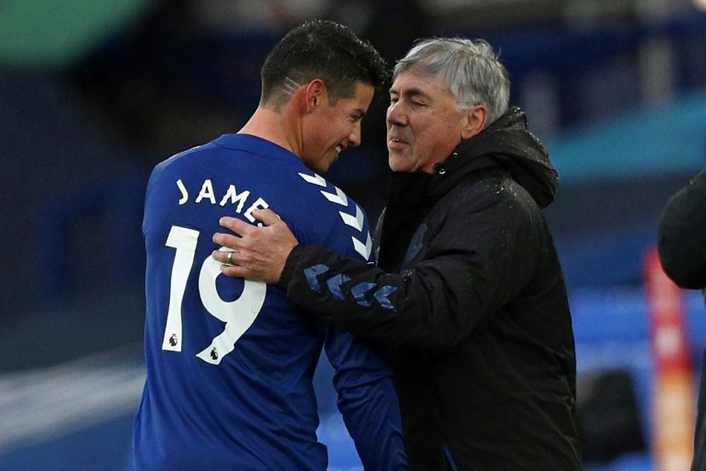 Everton midfielder James Rodriguez is congratulated by boss Carlo Ancelotti