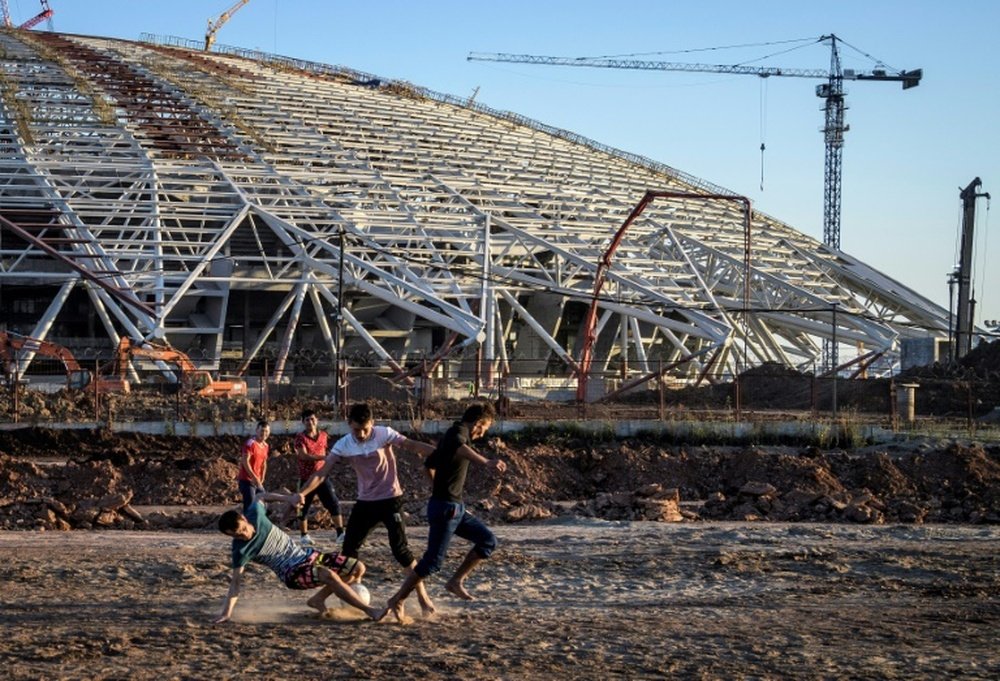 For a while last year, construction workers played football on the waste ground outside