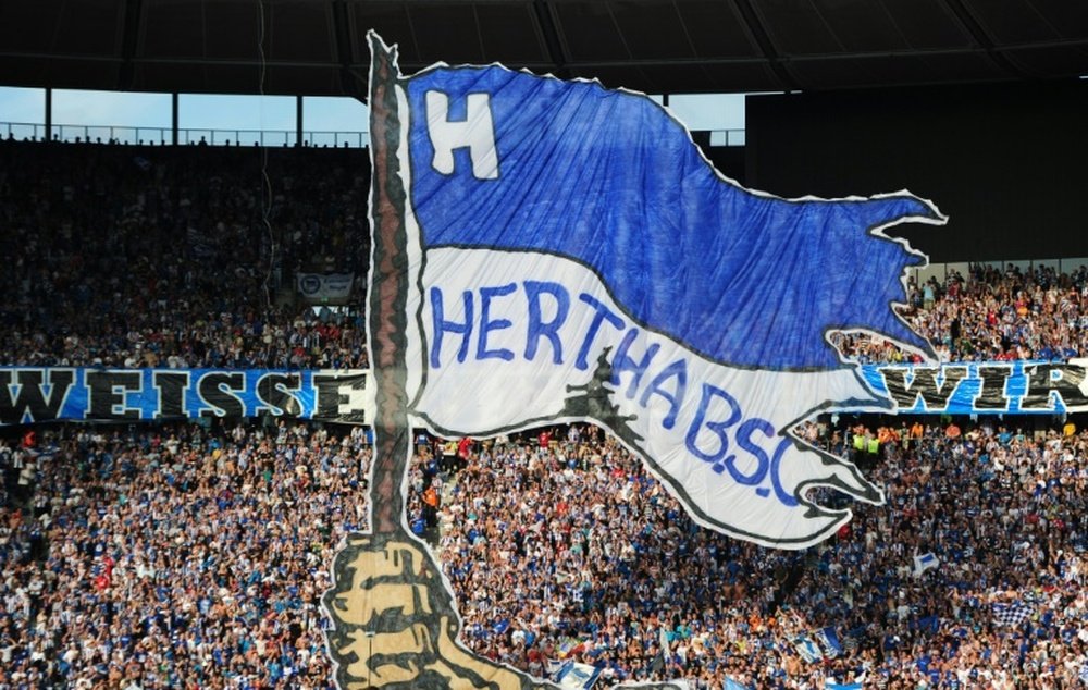 Hetha Berlin supporters cheer prior to a match on August 6, 2011