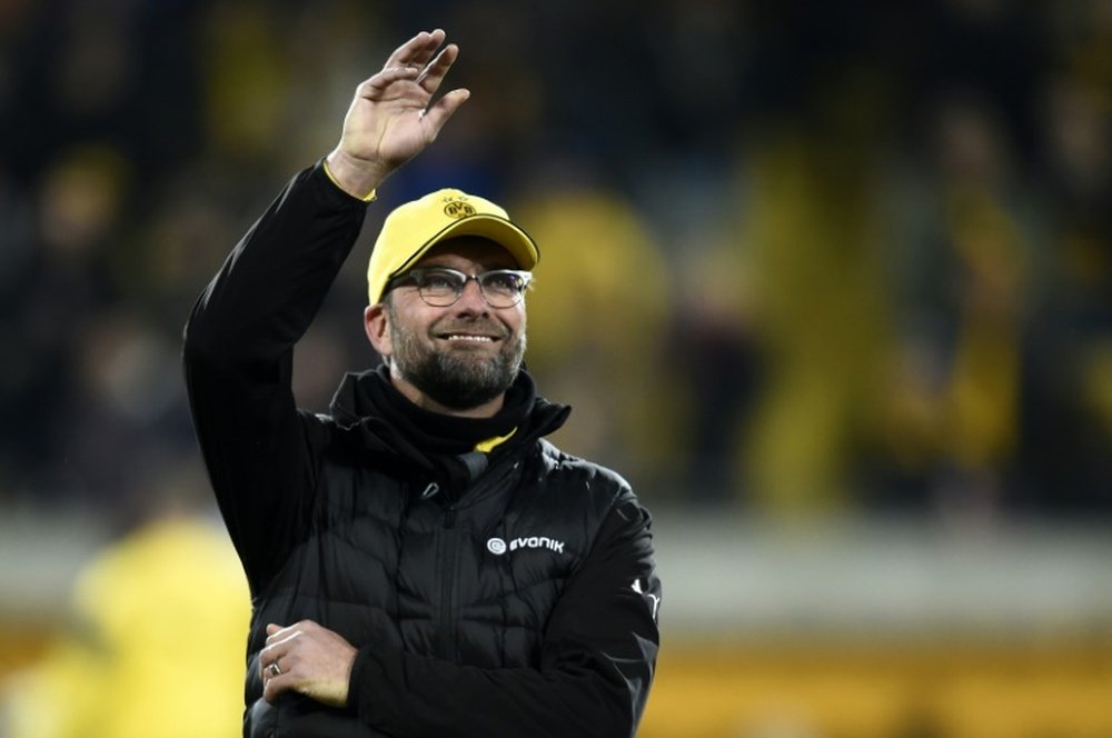 Former Borussia Dortmund boss Jurgen Klopp signs a reported three-year contract with Liverpool and succeeds Brendan Rodgers, who was sacked