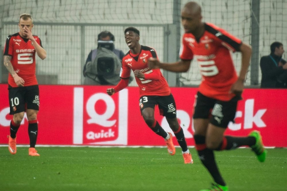 Rennes forward Ousmane Dembele (C) celebrates after scoring during the French L1 football match Olympique de Marseille vs Rennes on March 18, 2015 at the Velodrome stadium in Marseille, France