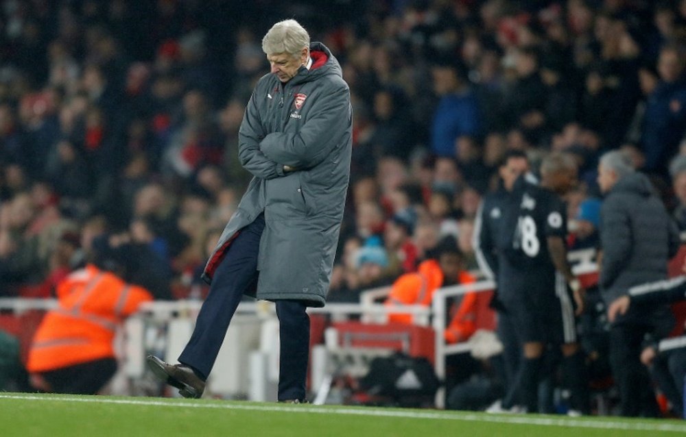 Wenger voltou a deixar uma 'pequena bicada' em Mourinho. AFP