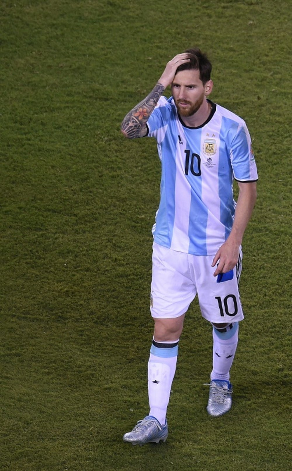 Argentina's Lionel Messi leaves the field after being defeated by Chile in the penalty shoot-out of the Copa America Centenario final in East Rutherford, New Jersey, United States, on June 26, 2016