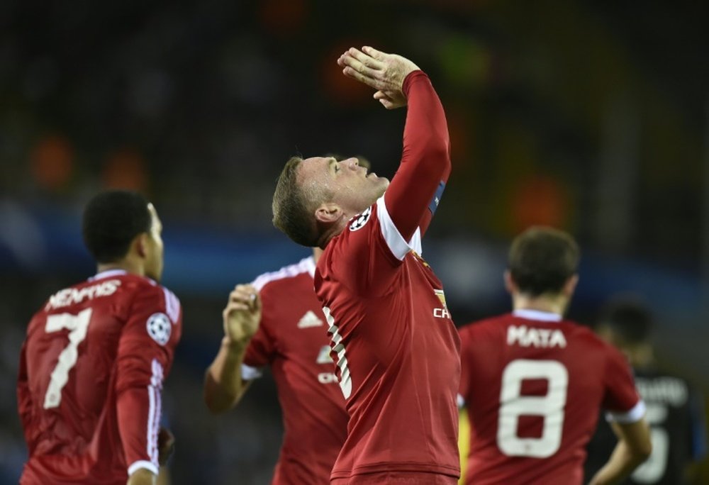 Manchester Uniteds Wayne Rooney celebrates after scoring a goal during the UEFA Champions League play-off round second leg football match between Club Brugge and Manchester United in Bruges, Belgium
