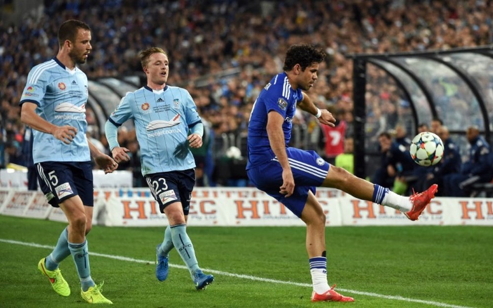 Chelsea forward Diego Costa (R) is challenged by Sydney FC defenders Rhyan Grant (2L) and Matthew Jurman (L) during a friendly in Sydney on June 2, 2015