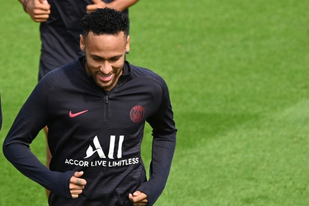 Neymar takes part in PSG training while his departure made headlines. AFP