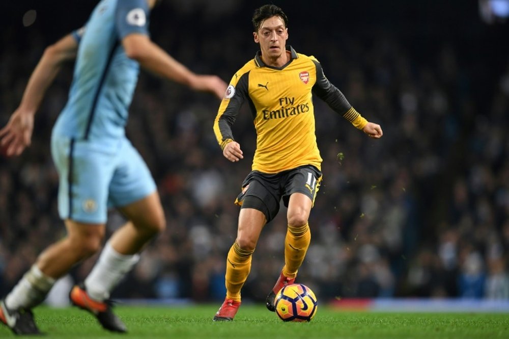 Ozil likes Arsenal's chances against a 'more vulnerable' Bayern. AFP