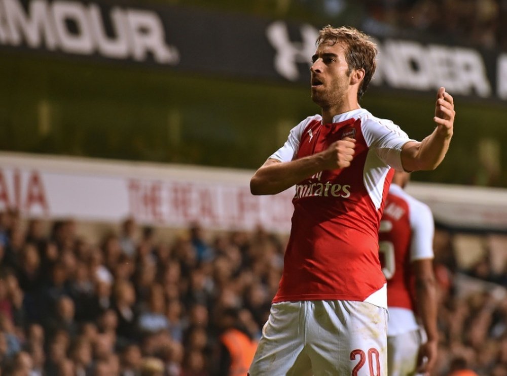 Arsenals Mathieu Flamini celebrates scoring a goal during their English League Cup 3rd round match against Tottenham Hotspur, at White Hart Lane in north London, on September 23, 2015