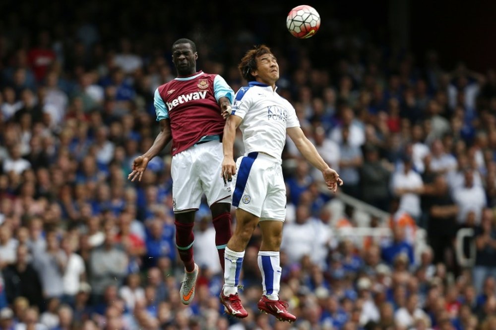West Ham Uniteds Spanish midfielder Pedro Obiang (L) jumps for a header with Leicester Citys Japanese striker Shinji Okazaki during the English Premier League football match at The Boleyn Ground in London on August 15, 2015