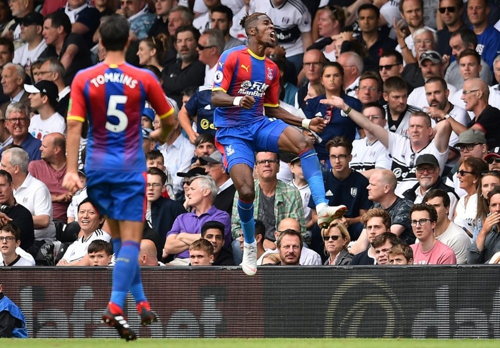 Zaha's strike helped Palace to a narrow victory over Huddesfield. AFP