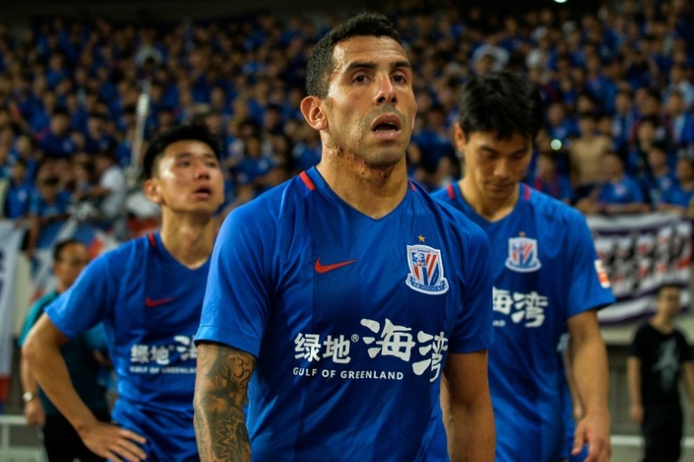 Tevez walks to stands after losing to SIPG. AFP