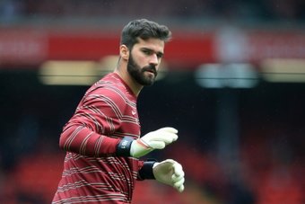 Alisson and Liverpool want to keep winning titles. AFP