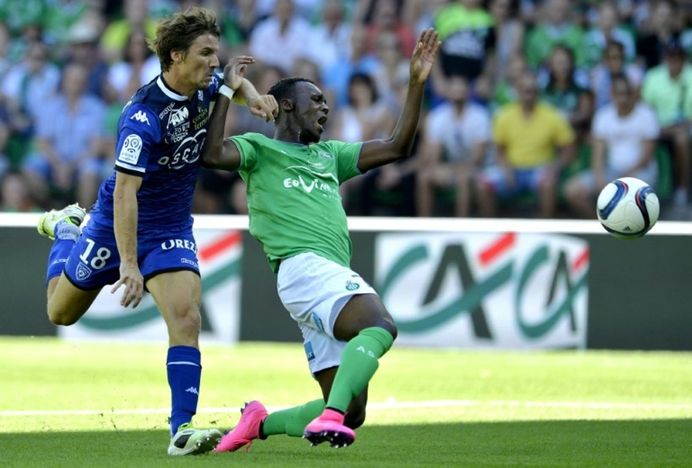 Bastias midfielder Yannick Cahuzac (L) clashes with Saint-Etiennes forward Jean-Christophe Bahebeck during a French L1 football match on August 30, 2015, at the Geoffroy Guichard Stadium in Saint-Etienne, central France