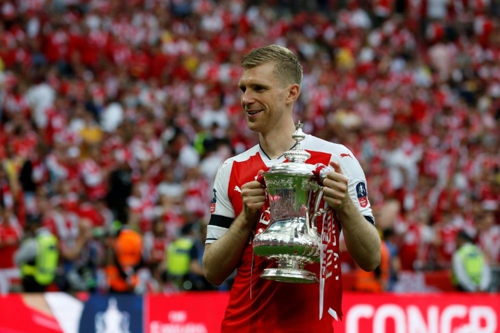 Smith praises Mertesacker. AFP