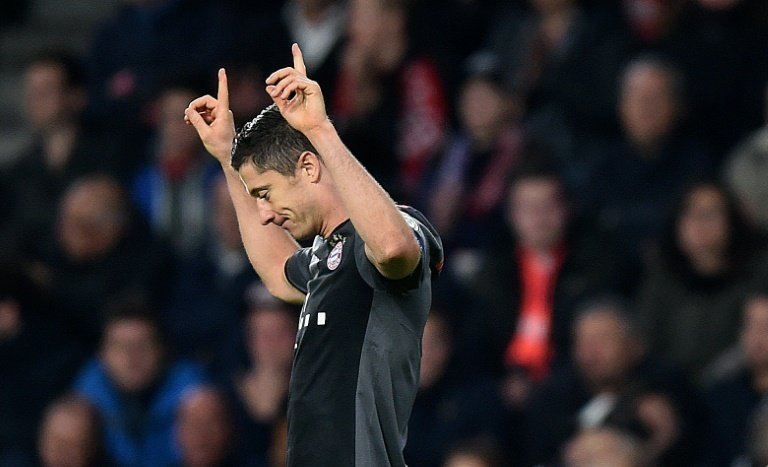 Bayern Munichs Lewandowski celebrates after scoring a second goal against Eindhoven. AFP