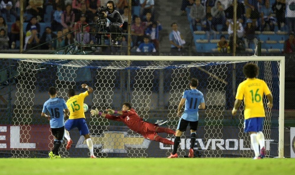Paulinho (2nd-L) scores the second of his three goals as Brazil thrash Uruguay 4-1
