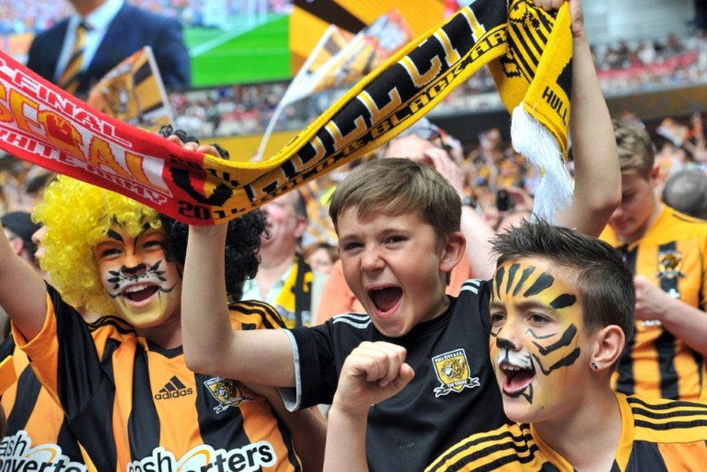 Young Hull City fans cheer before the start of the English FA Cup final match between Arsenal and Hull City at Wembly Stadium in London on May 17, 2014
