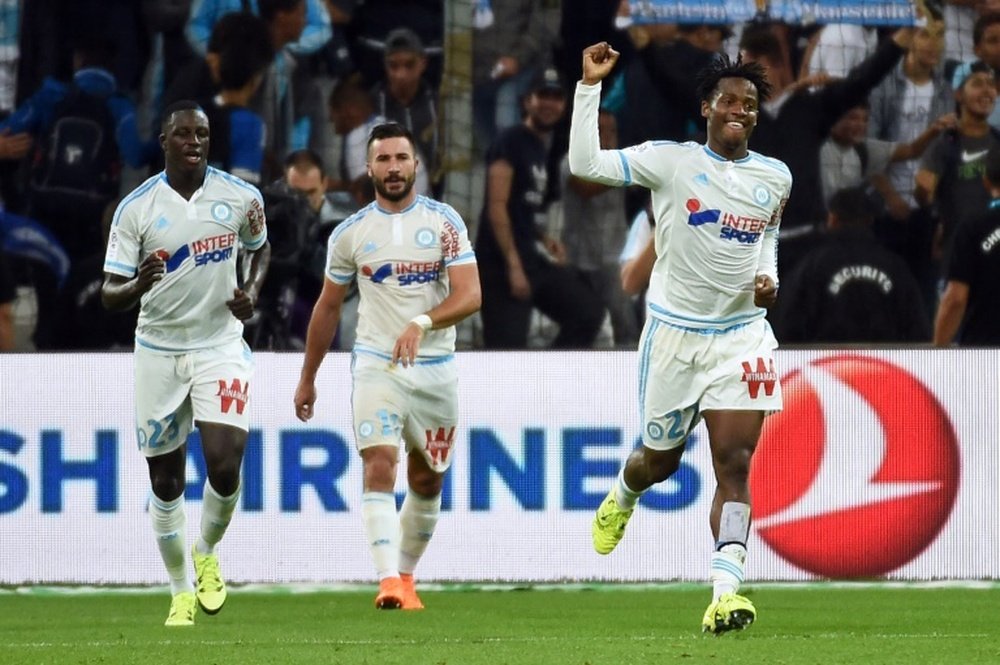 Marseilles forward Michy Batshuayi (R) celebrates after scoring a goal during a French L1 football match against Bastia at Velodrome Stadium in Marseille, southern France, on September 13, 2015