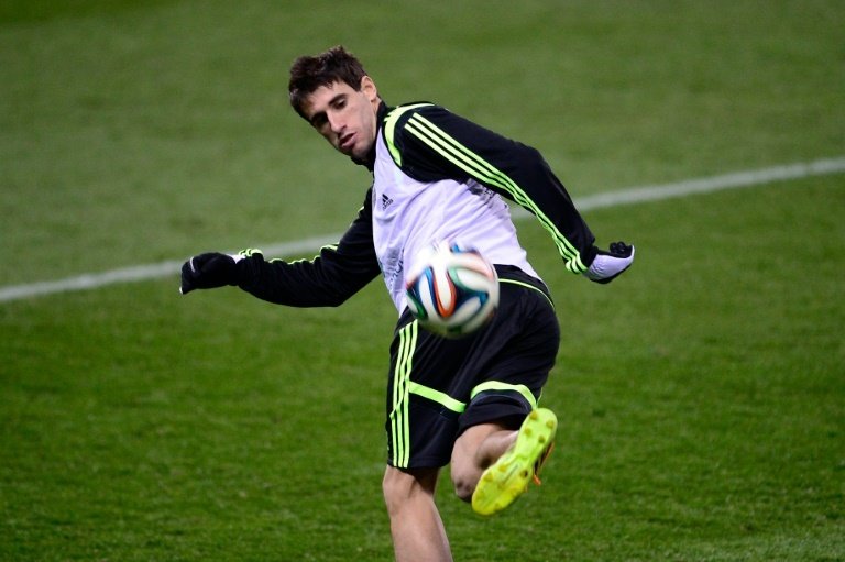 Spains defender Javi Martinez controls the ball during a training session at the Vicente Calderon stadium in Madrid on March 4, 2014