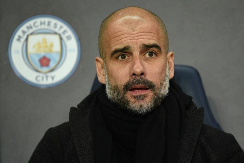 Pep is focused on seeing off a successful Premier League campaign. AFP