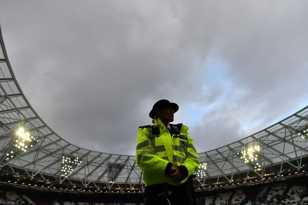 Police were hsown spraying fans at the match. AFP