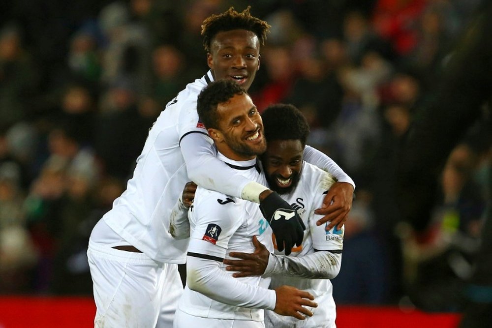 Swansea hit eight in FA Cup rout, Huddersfield advance. AFP