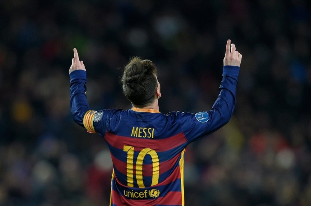 Barcelonas forward Lionel Messi celebrates after scoring during the UEFA Champions League Group E football match FC Barcelona vs AS Roma at the Camp Nou stadium in Barcelona on November 24, 2015