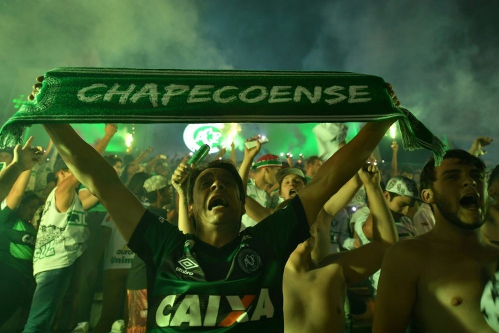 Brazils Chapecoense football club fans participate in a tribute to the players killed in the LaMia airlines plane crash at the clubs stadium in Chapeco, Santa Catarina, Brazil, on November 30, 2016