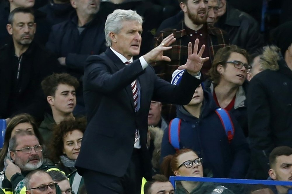 Southampton have reportedly approached former Stoke City boss Mark Hughes. AFP