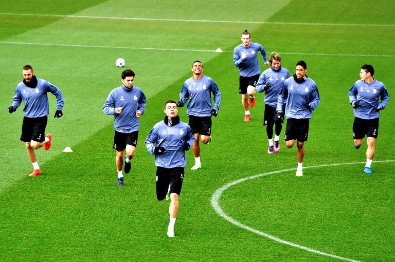 Real Madrid's players run during a training session at Valdebebas training ground. AFP