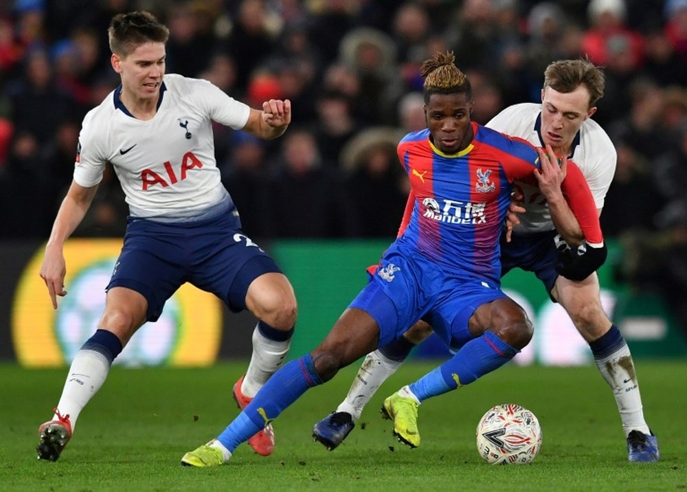 Wilfried Zaha (C) will not be allowed to leave Palace this summer. AFP