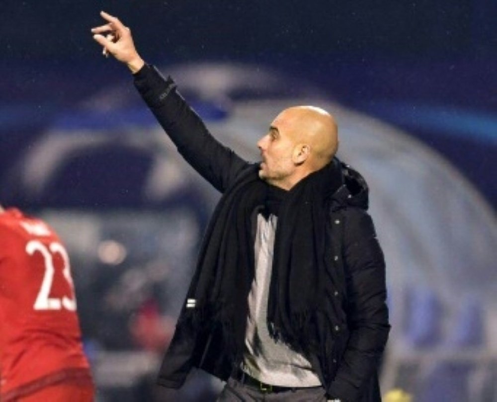 Bayern Munichs Spanish head coach Pep Guardiola gestures during the UEFA Champions League football match between Dinamo Zagreb vs Bayern Munich at the Maksimir stadium in Zagreb on December 9, 2015