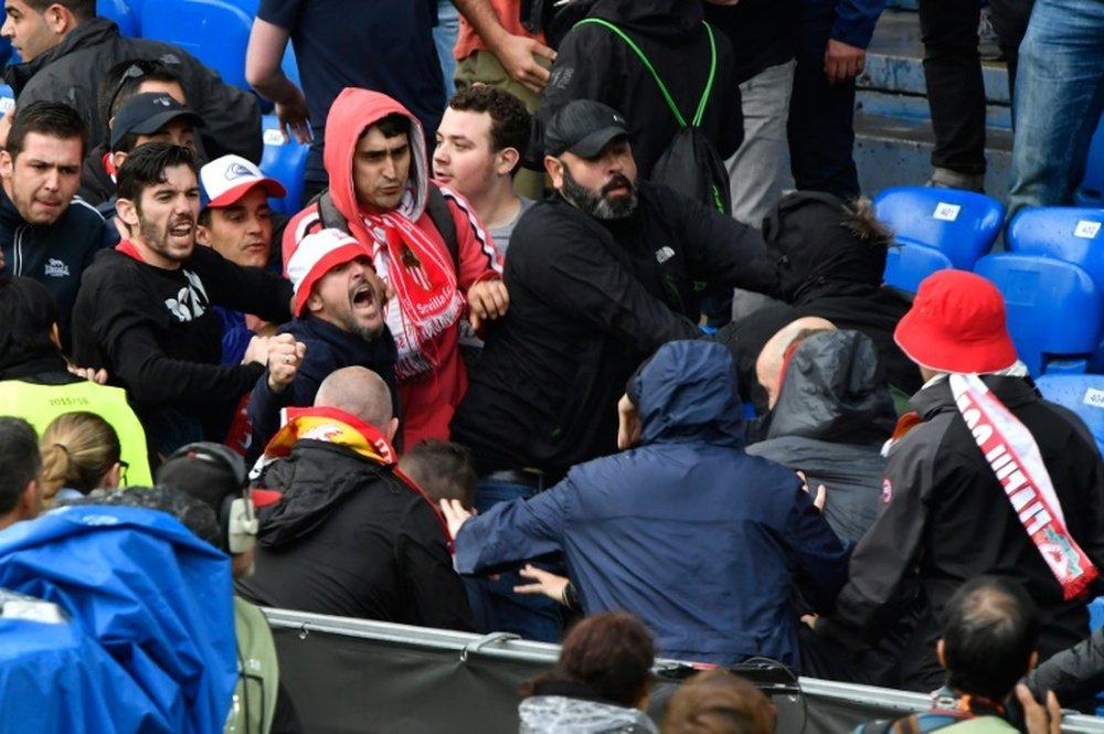 Sevillas and Liverpools supporters fight pior to the UEFA Europa League final football match between Liverpool FC and Sevilla FC in Basel, on May 18, 2016