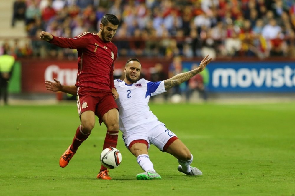 Spains forward Alvaro Morata (L) vies with Luxembourgs defender Maxime Chanot during the Euro 2016 qualifying football match Spain vs Luxembourg at Las Gaunas stadium in Logrono on October 9, 2015