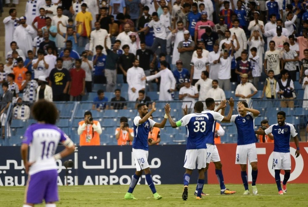 Al Hilal's players celebrate after overcoming Al-Ain on Monday. AFP