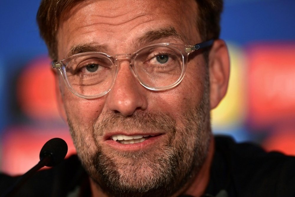 Klopp wants to stop Real winning three Champions League trophies in a row. AFP