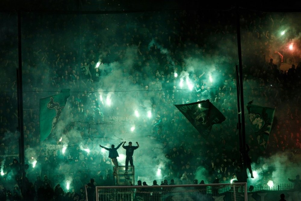 Panathinaikos were fined 190,000 euros and instructed to play four home matches behind closed doors, while the league handed Olympiakos a 3-0 victory for the disrupted match