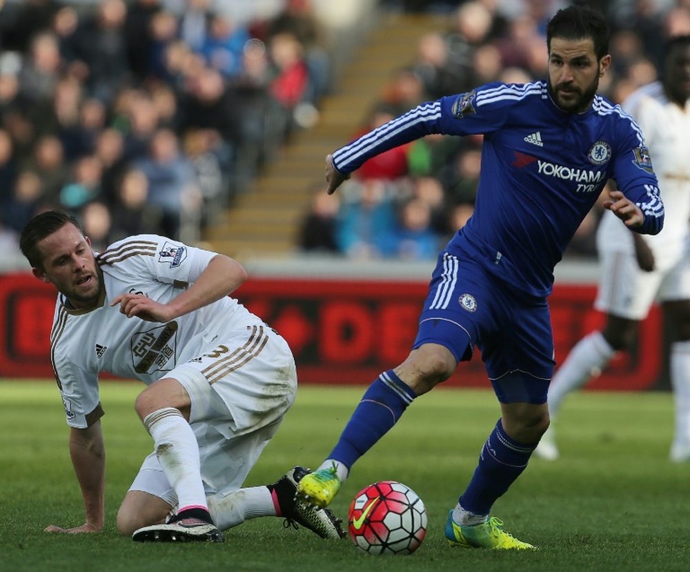 Fabregas (R) in action for Chelsea. AFP
