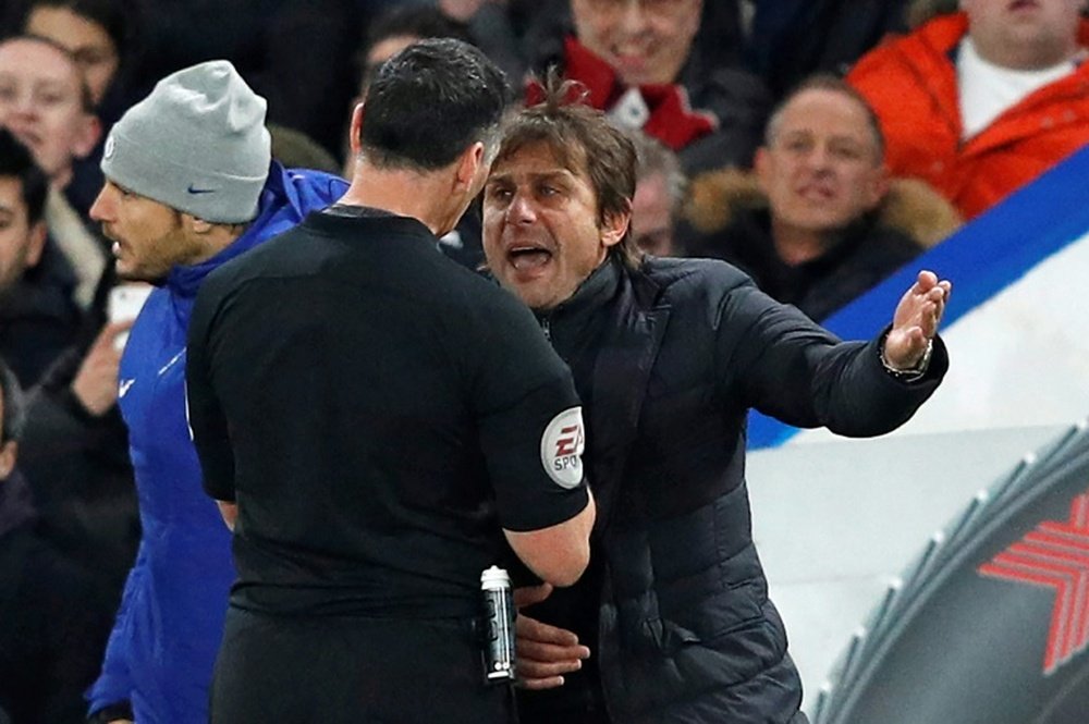 Chelsea edge out Swansea as Conte sees red. AFP