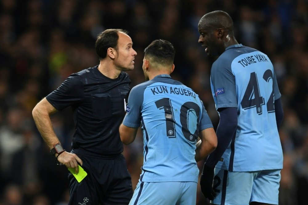 Manchester City midfielder Yaya Toure and striker Sergio Aguero remonstrate with the referee. AFP