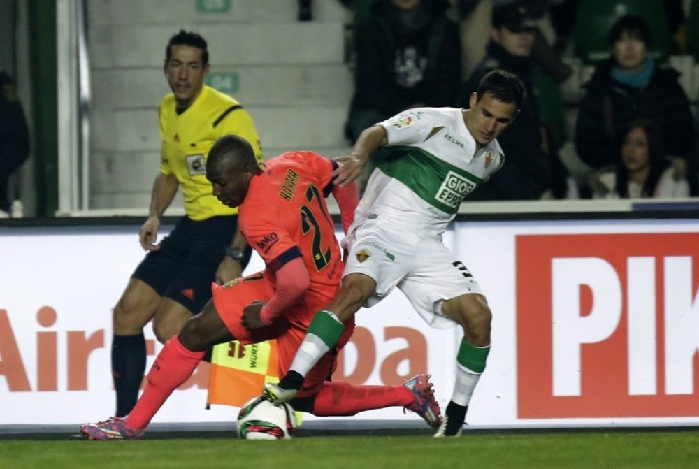 Adama Traore (centre) battles with Elches Franco Fragapane during a Copa del Rey match in Elche on January 15, 2015