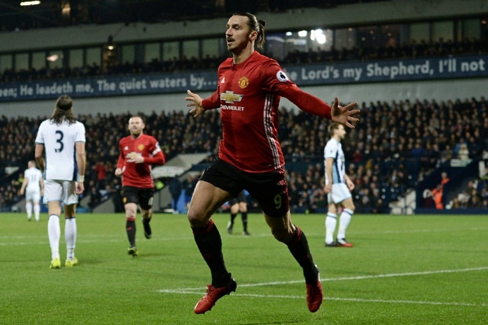 Ibrahomovic celebrates one of his two goals against Manchester United. AFP
