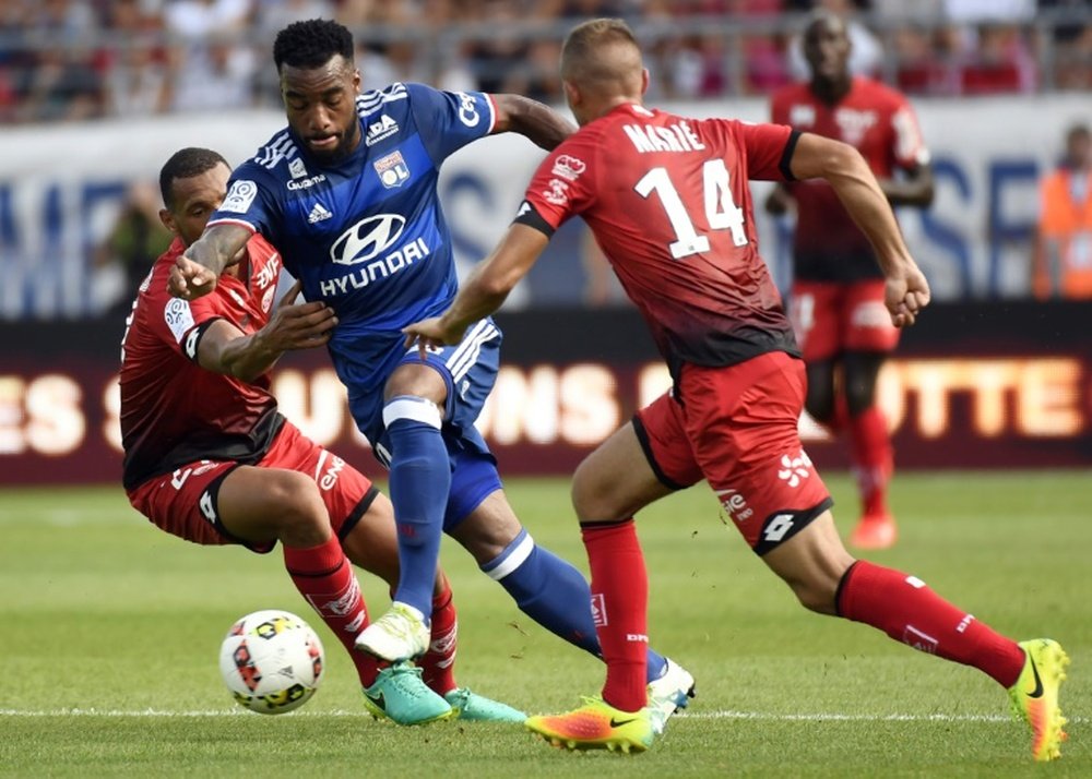 Lyons French forward Alexandre Lacazette (C), pictured on August 27, 2016, put his team up on 37 minutes at the Stade Gaston-Gerard with his sixth goal this season, but hobbled off just before the break and was later seen with an ice pack