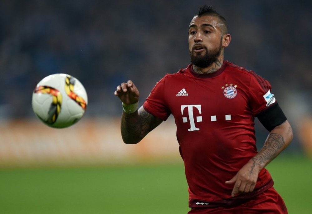 Bayern Munichs Chilean midfielder Arturo Vidal runs with the ball during a Bundesliga match against Schalke in Gelsenkirchen on November 21, 2015