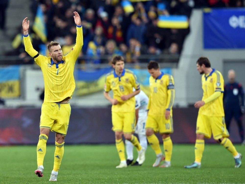 Ukraine's Andriy Yarmolenko (L) celebrates after scoring against Slovenia. BeSoccer