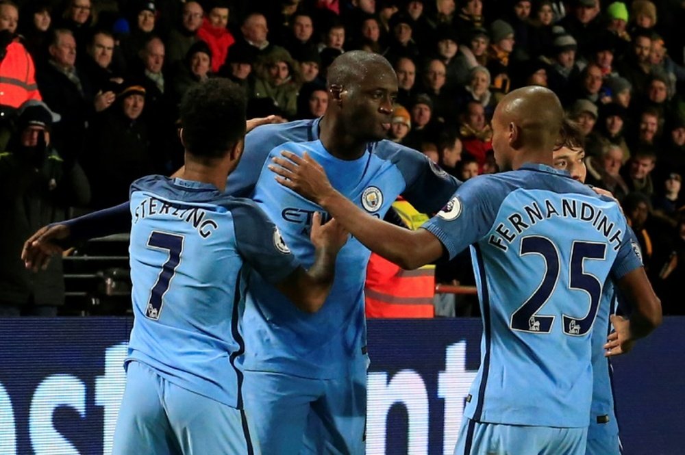 Manchester Citys Yaya Toure (C) celebrates scoring a goal during their English Premier League match against Hull City, at the KCOM Stadium in Kingston upon Hull, on December 26, 2016