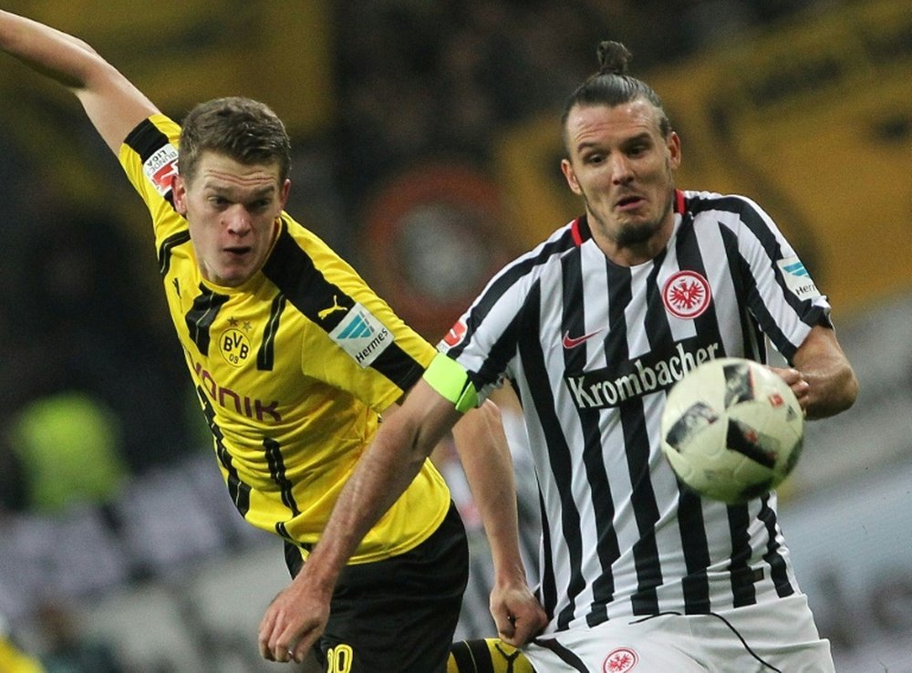 Meier and Dortmunds Ginter vie for the ball during the German first division Bundesliga. AFP