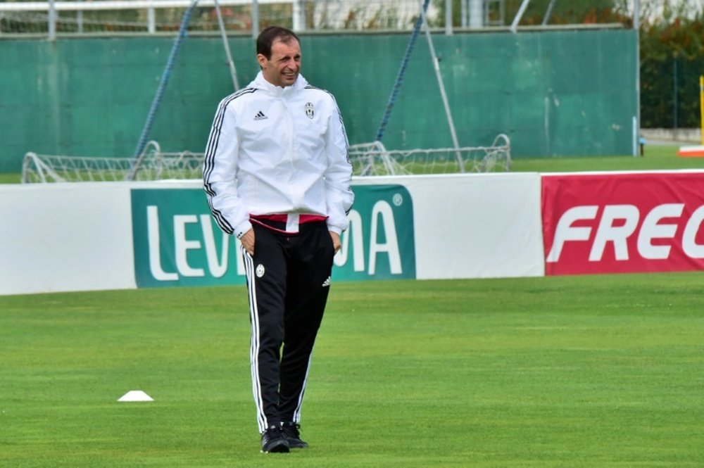 Juventus coach from Italy Massimiliano Allegri looks on during a training session on the eve of the UEFA Champions League football match Juventus vs Sevilla FC at Vinovo Training centre  on September 29, 2015 in Turin