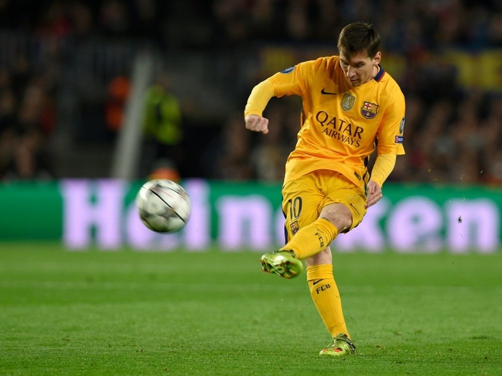 Barcelonas Lionel Messi kicks the ball during the UEFA Champions League quarter finals against Atletico de Madrid at the Camp Nou stadium in Barcelona on April 5, 2016