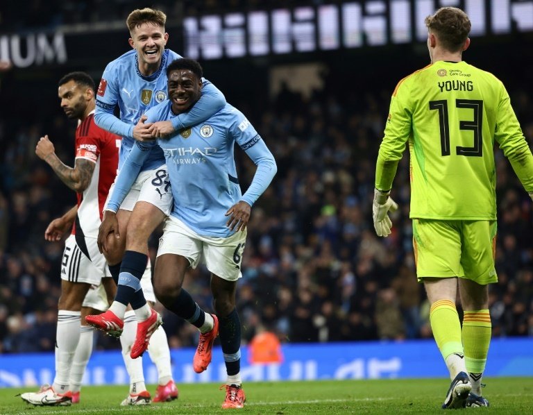 Man City score eight to demolish Salford and progress in FA Cup